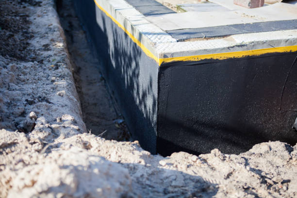 Professional Waterproofing technician working in East Islip, NY